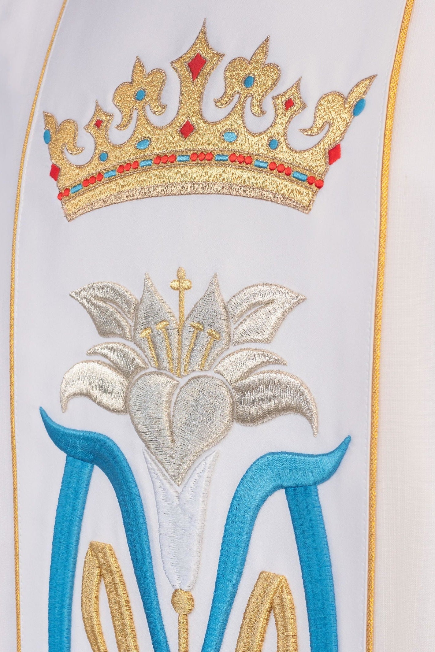 Marian chasuble featuring an embroidered crown and Marian emblem